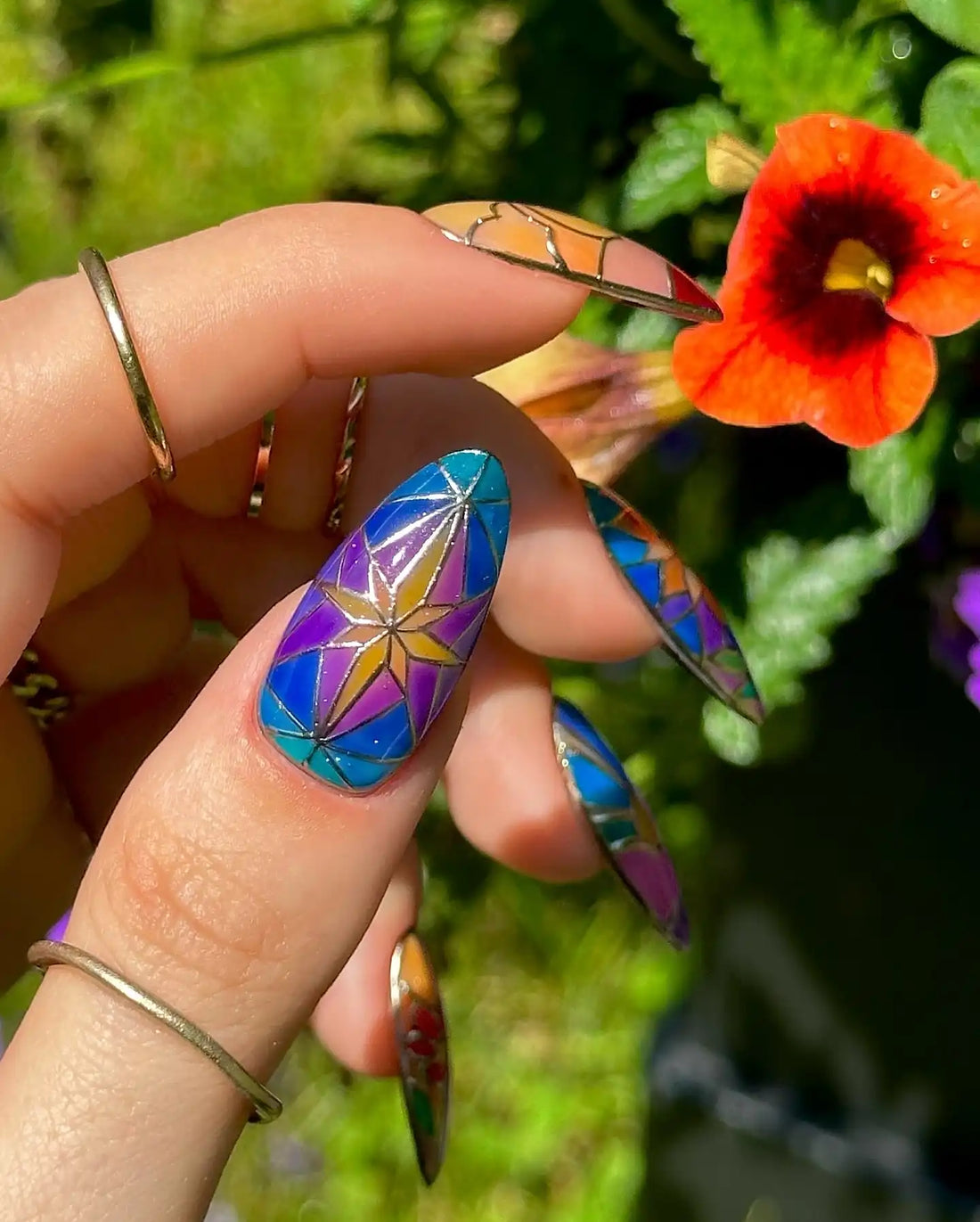 Handmade stained glass floral press-on nails with rainbow garden spring art design