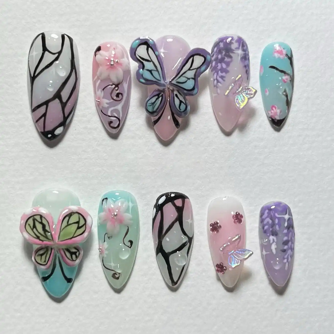 Handmade 3D press-on nails with butterfly wings, flowers, wisteria, and spring fantasy designs
