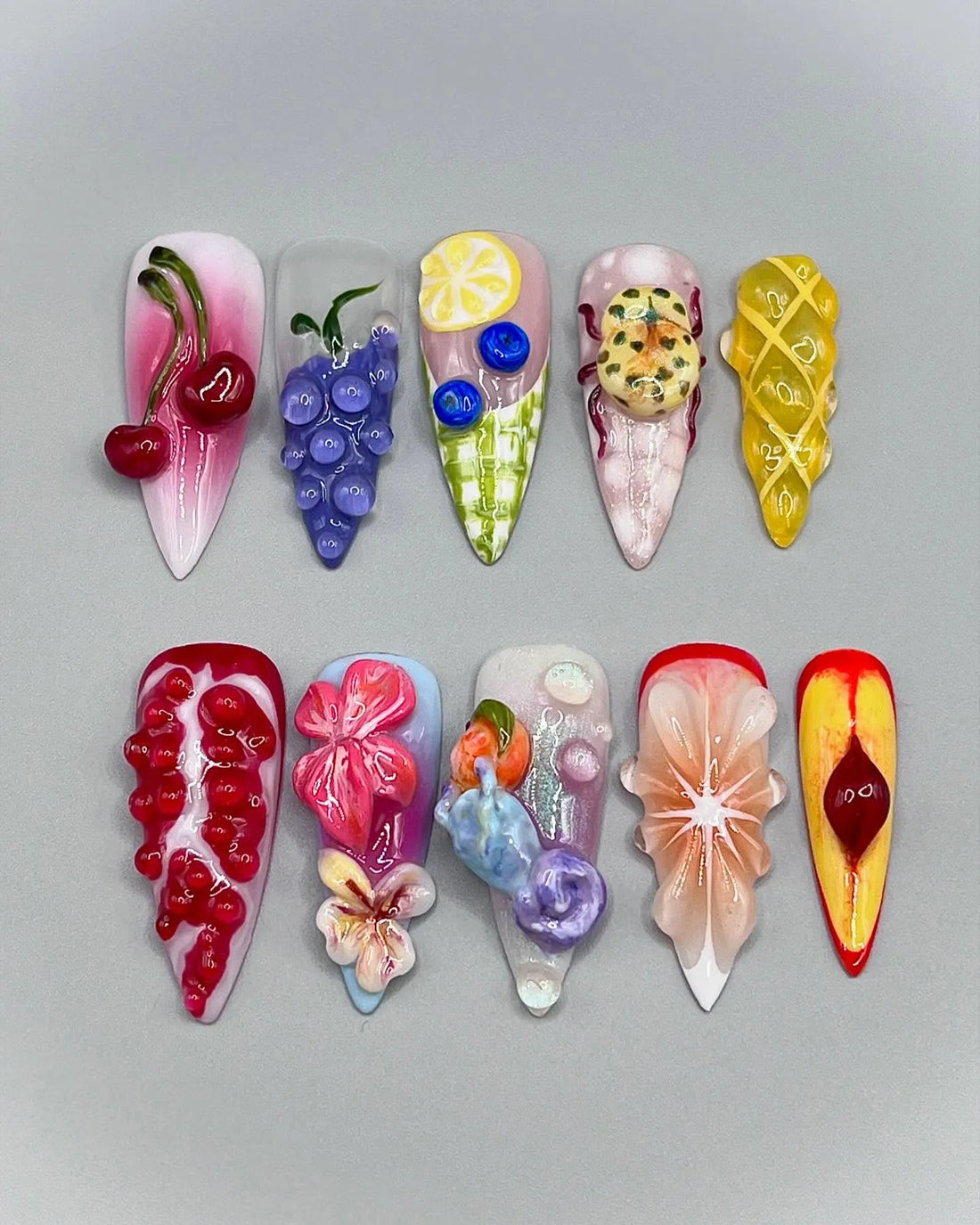 Handmade 3D press-on nails with cherry, lemon, pomegranate, and summer fruit designs