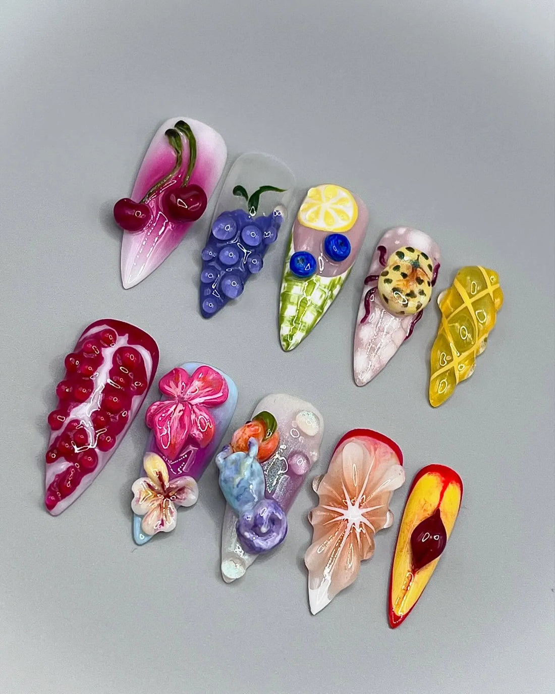 Handmade 3D press-on nails with cherry, lemon, pomegranate, and summer fruit designs