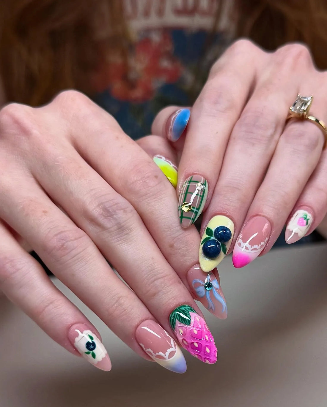 Handmade 3D fruit press-on nails with strawberry, blueberry, lace, and plaid designs.