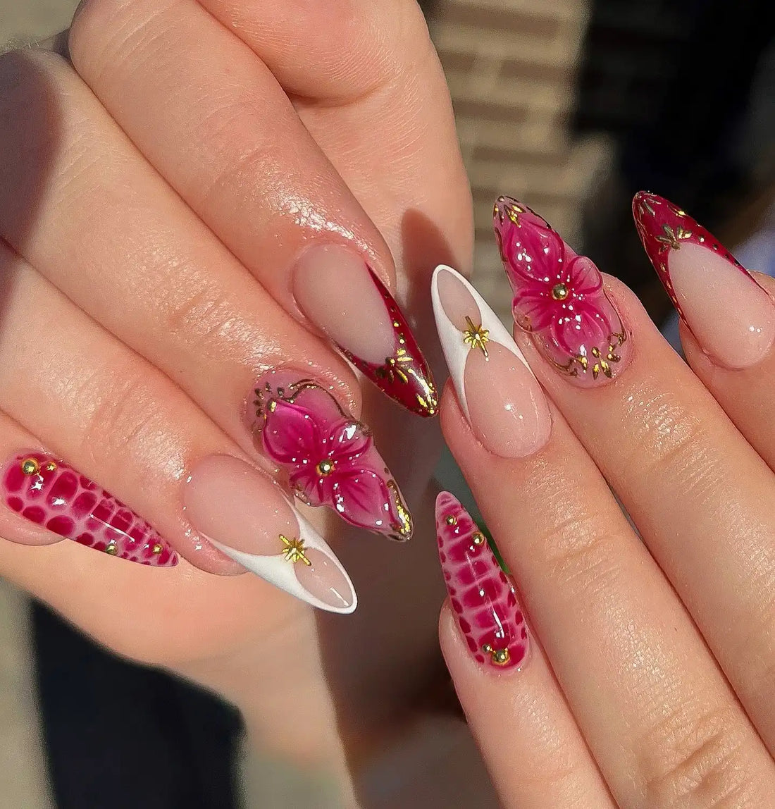 Handmade press-on nails with pink 3D floral, crocodile texture, and gold accents.