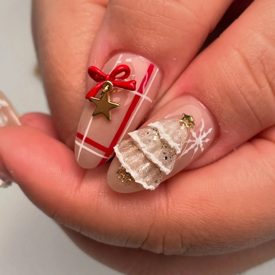 Handmade Christmas press-on nails with Santa, snowman, candy cane, and holiday decorations