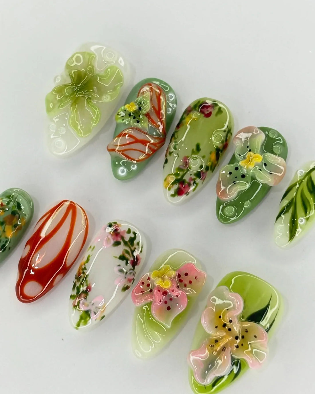 Handmade 3D press-on nails with green tropical orchid and lily floral designs