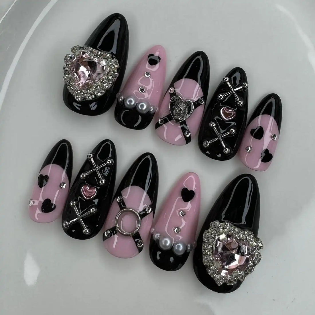 Handmade black and pink heart punk press-on nails with pearls and rhinestone accents