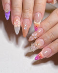 Handmade press-on nails with 3D butterfly, flower accents, and pastel mermaid designs