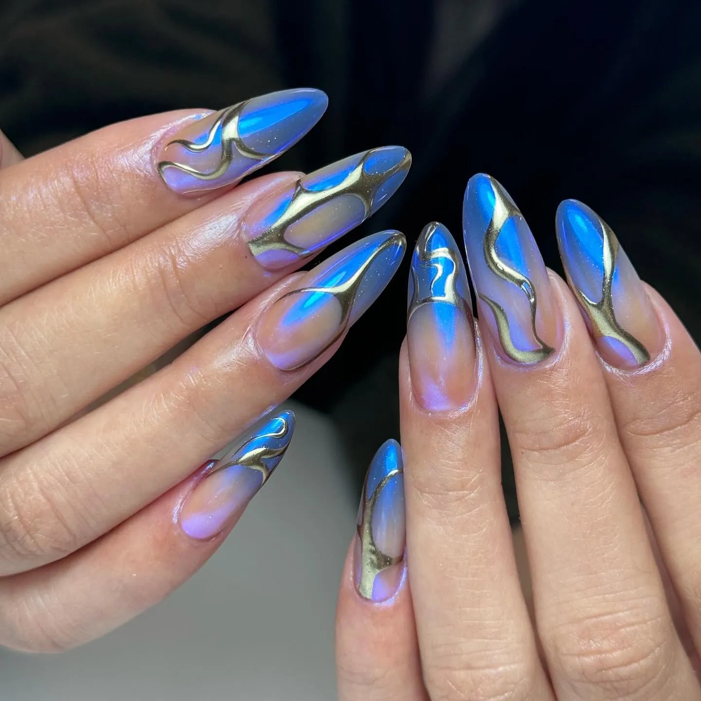 Handmade press-on nails with blue chrome and metallic cyberpunk abstract design