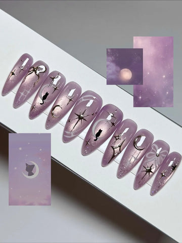Handmade iridescent purple stiletto press-on nails with celestial moon, star, and cat designs
