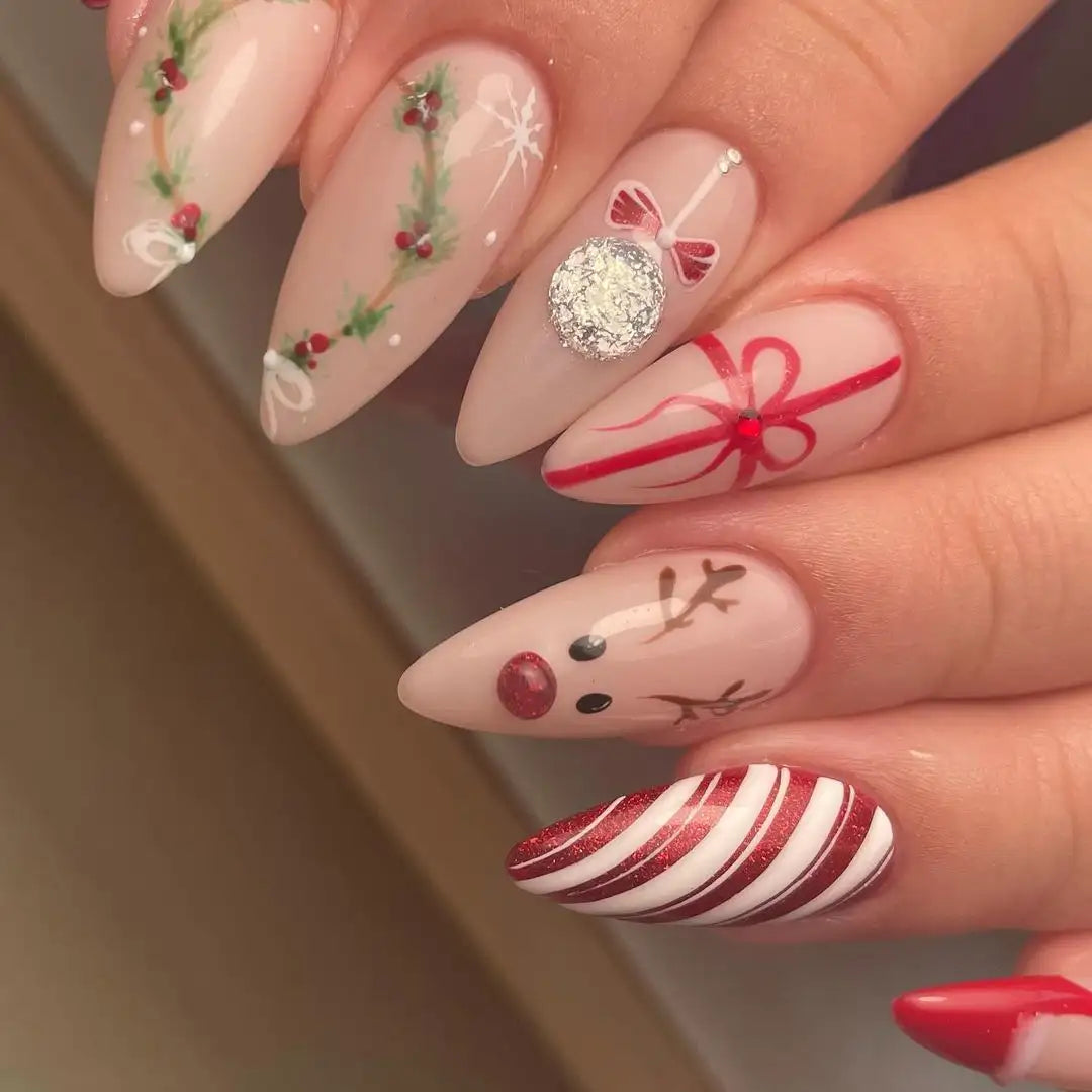 Handmade Christmas press-on nails with reindeer, wreath, ornament, snowflake, and candy cane designs