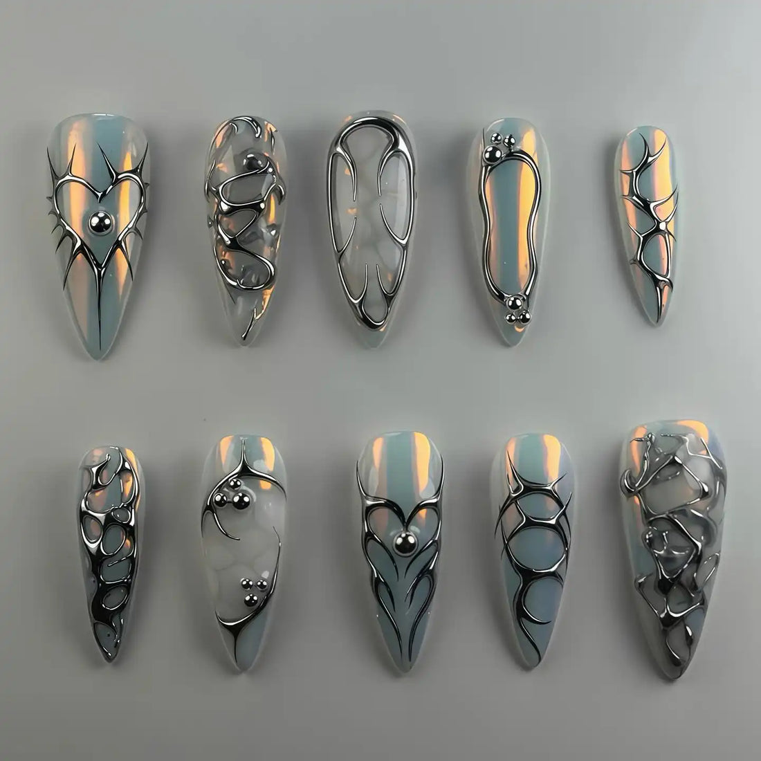 Handmade chrome silver 3D heart abstract metallic press-on nails with futuristic designs