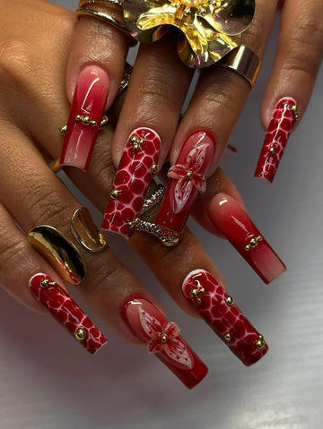 Handmade crimson red ombre crocodile print press-on nails with 3D flower and gold accents