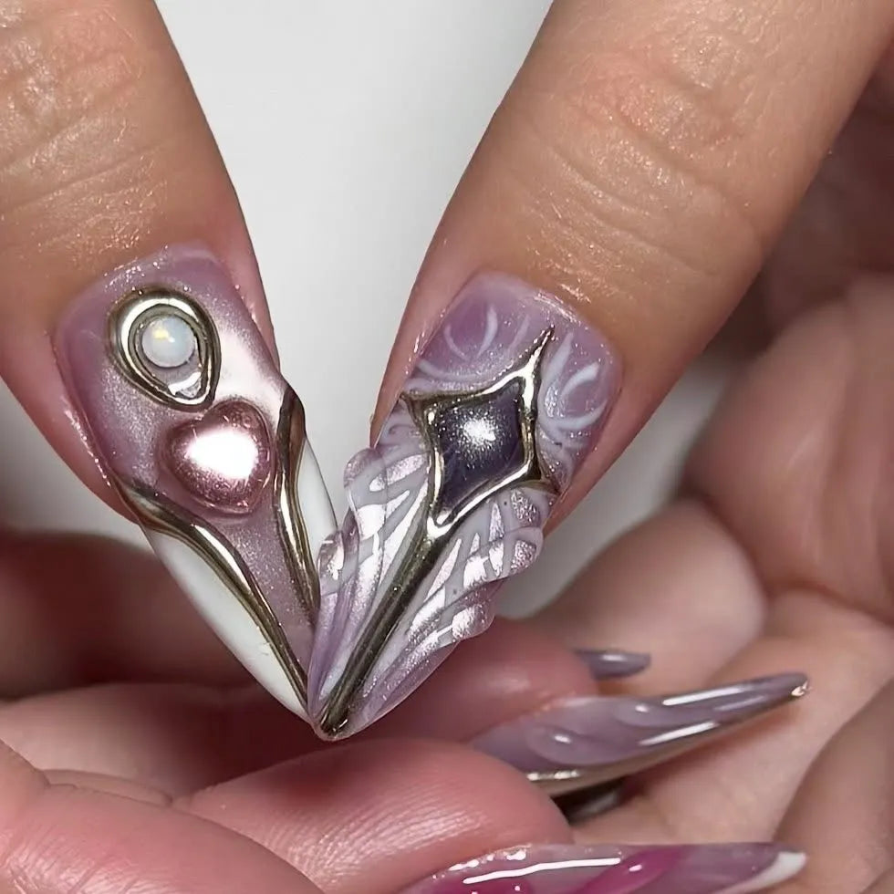 Handmade iridescent pink metallic press-on nails with 3D heart, star, and bow designs