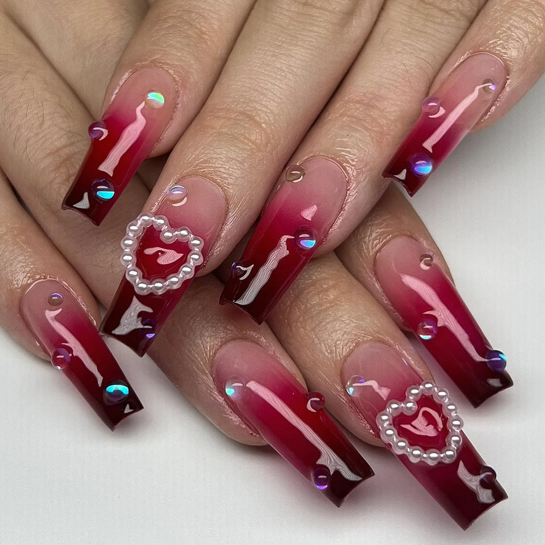 Handmade dark red ombre press-on nails with rhinestones and pearl heart accents