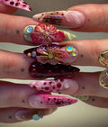 Handmade deep red 3D floral press-on nails with gemstone and artistic designs