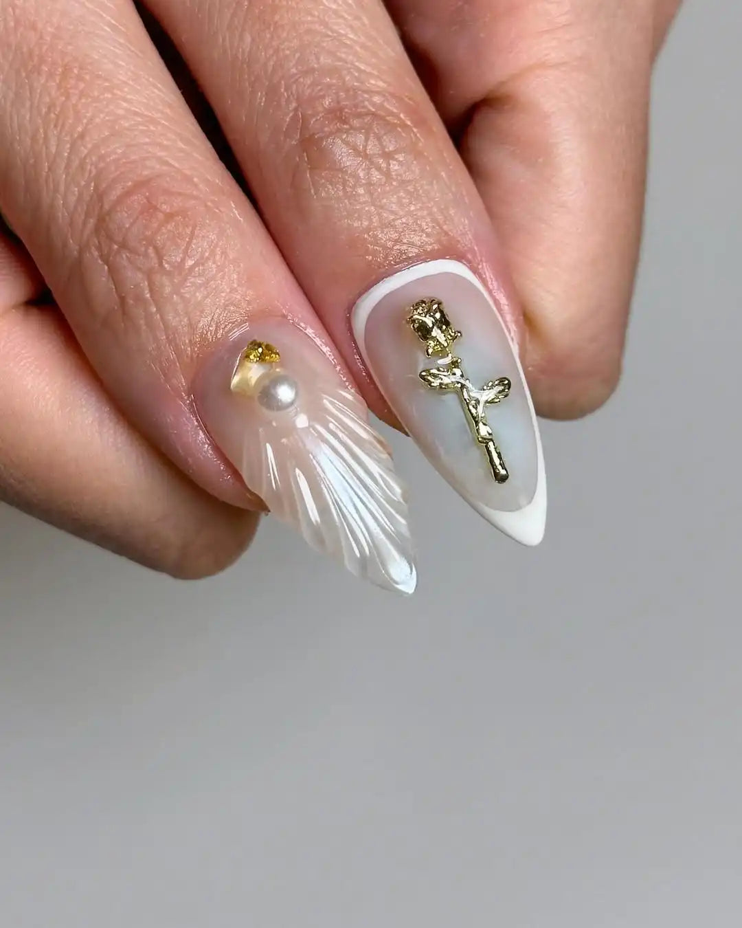 Handmade floral press-on nails with white French tips, gold accents, and 3D flower designs