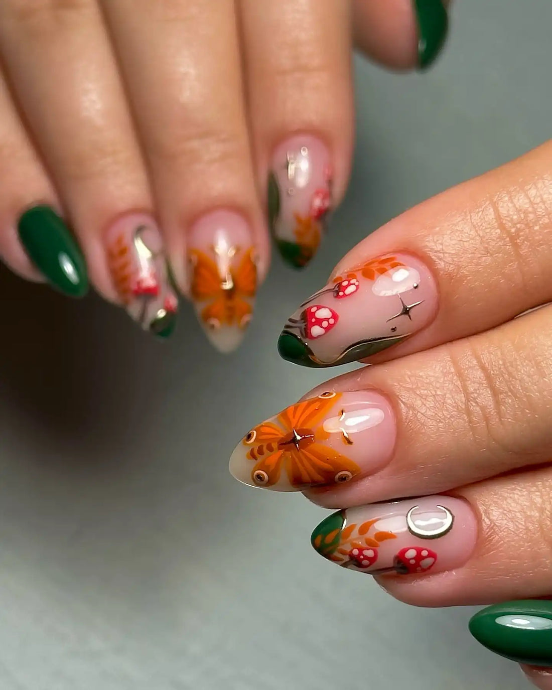 Handmade press-on nails with autumn butterfly, mushroom, moon, and fairycore designs.
