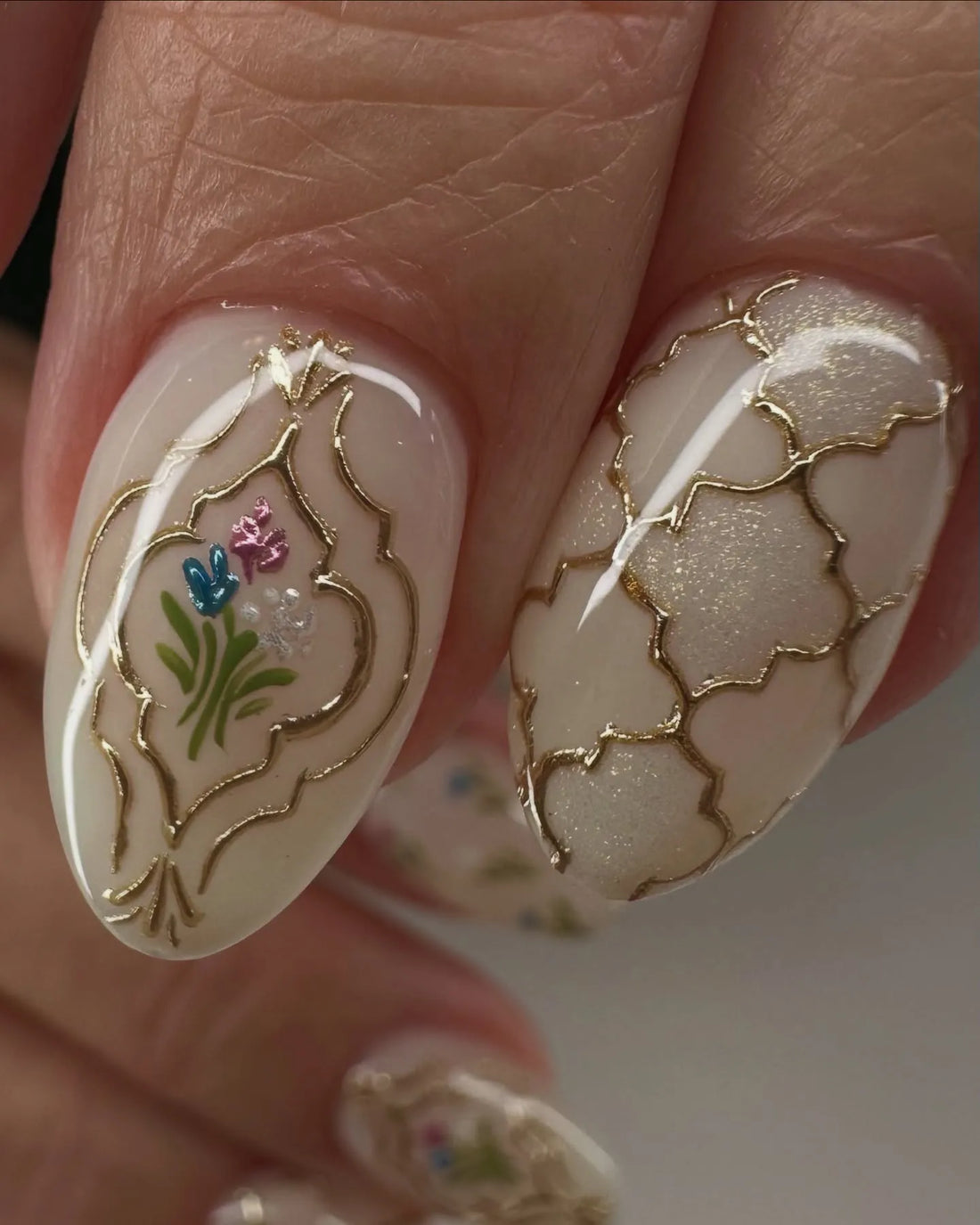 Handmade floral and gold trellis press-on nails with vintage-inspired artistic design.