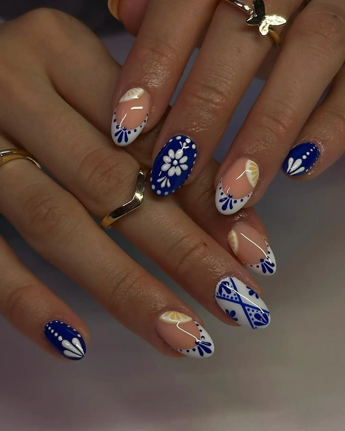 Handmade blue porcelain floral and lemon press-on nails with glossy finish