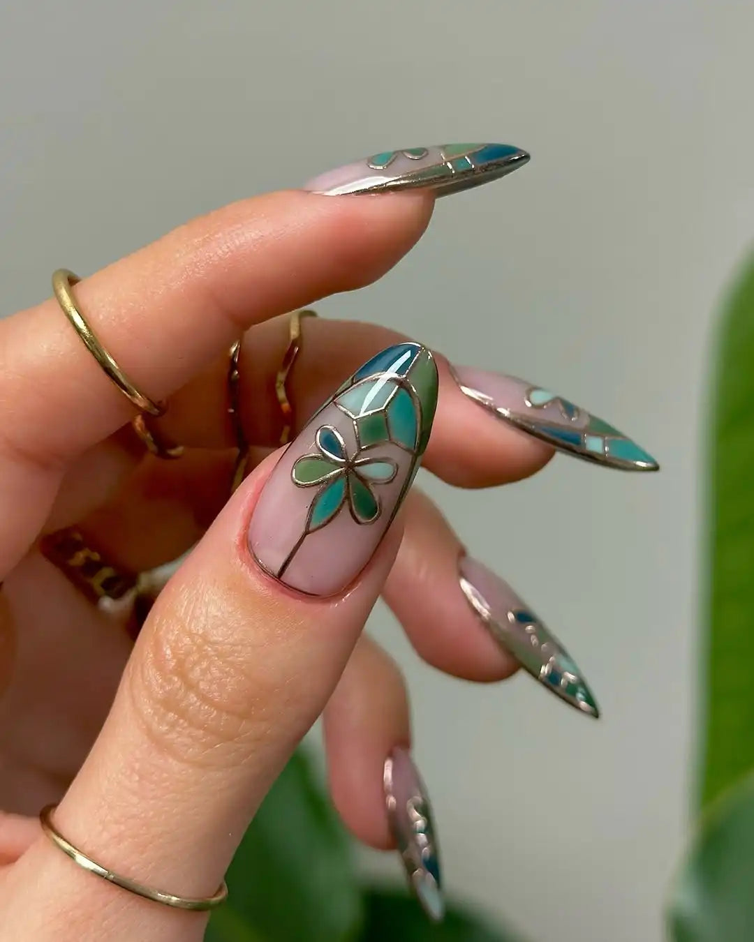 Handmade green floral stained glass press-on nails with elegant garden-inspired design