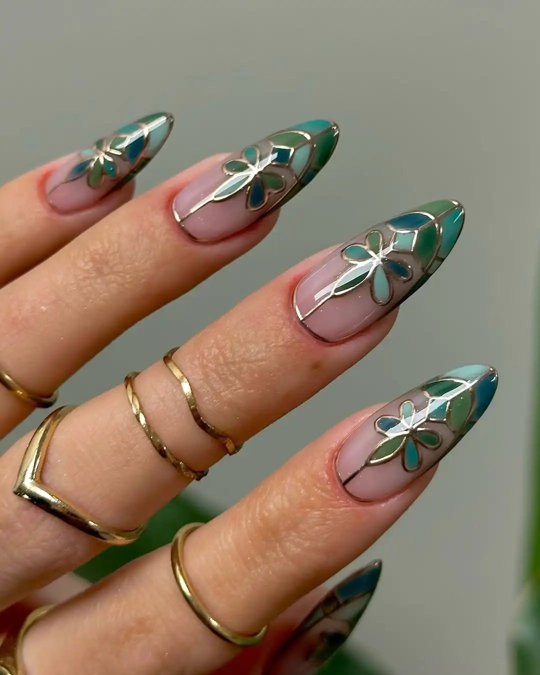 Handmade green floral stained glass press-on nails with elegant garden-inspired design