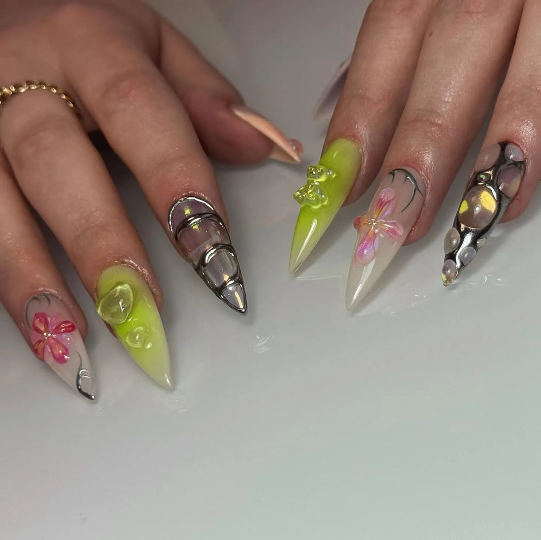 Handmade press-on nails with 3D bear, floral, iridescent, and silver metallic designs