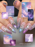 Handmade stiletto press-on nails with iridescent purple, gold moon, stars, and celestial designs.