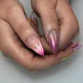 Hand with almond-shaped iridescent pink chrome and 3D floral press-on nails