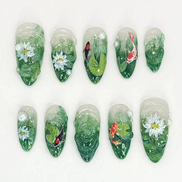 Handmade 3D green press-on nails with koi fish, lotus flowers, and pearl accents