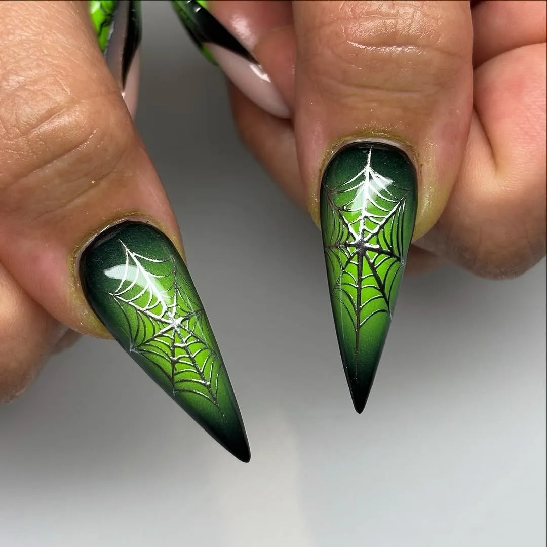 Handmade neon green and black press-on nails with 3D spider web and water drop designs.