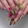 Handmade neon green, pink, and purple press-on nails with abstract drip and frog designs.