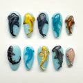 Handmade press-on nails with 3D ocean animal designs including sharks, dolphins, and whales.