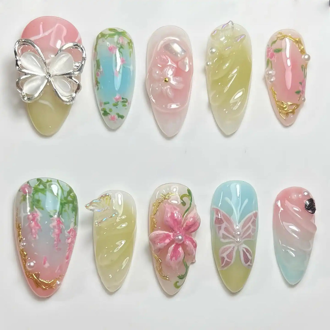 Handmade pastel press-on nails with 3D flower, butterfly, pearl and floral spring designs.