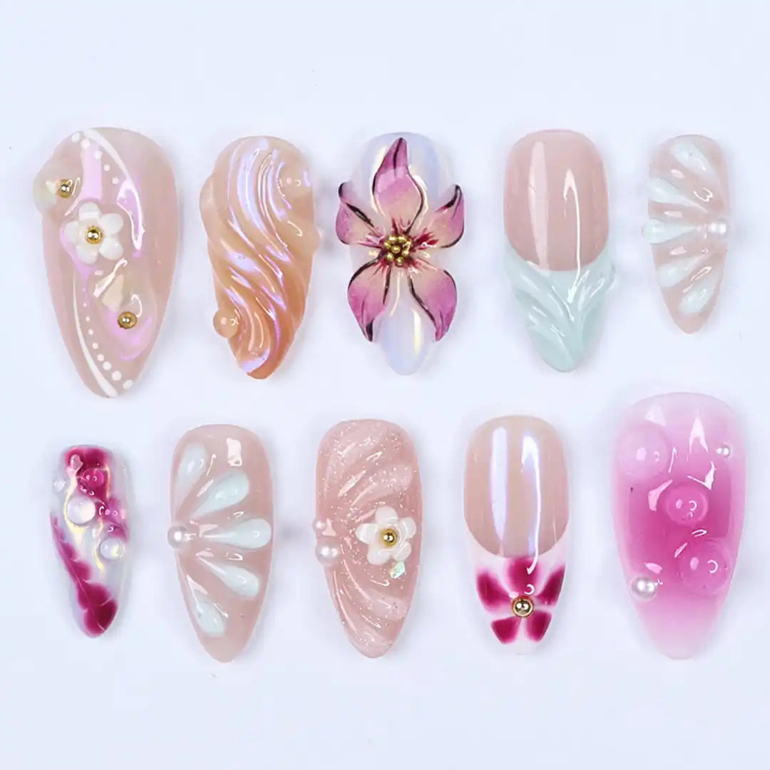 Handmade pink pearl iridescent press-on nails with 3D floral and elegant designs