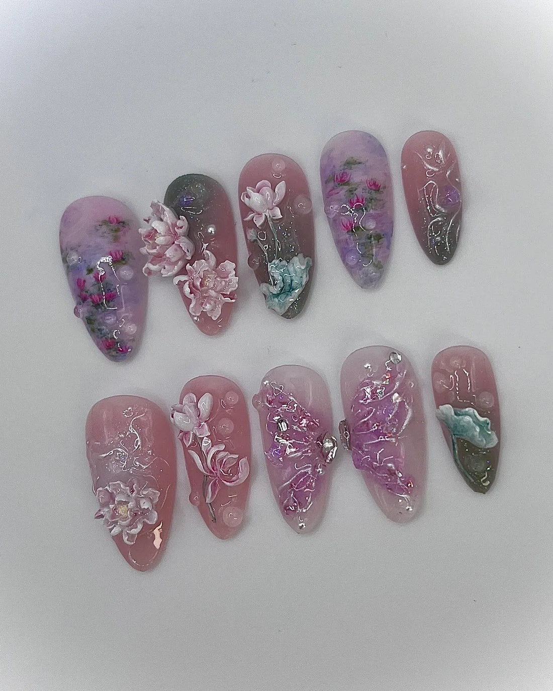 Handmade press-on nails with 3D pink and purple lotus flower and koi pond design