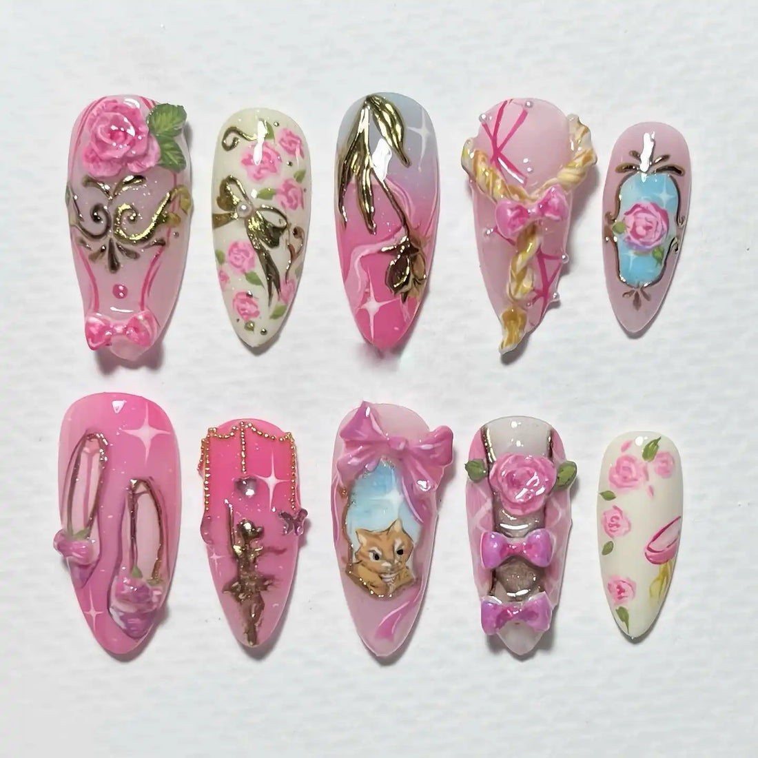 Handmade press-on nails with pink rose, ballet, cat, bow, and floral designs
