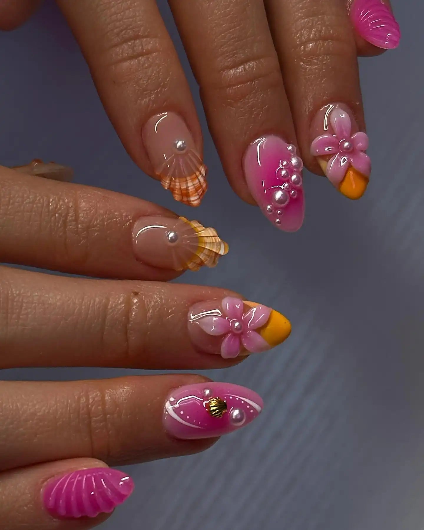 Handmade press-on nails with pink 3D flowers, pearls, shell and summer beach designs.