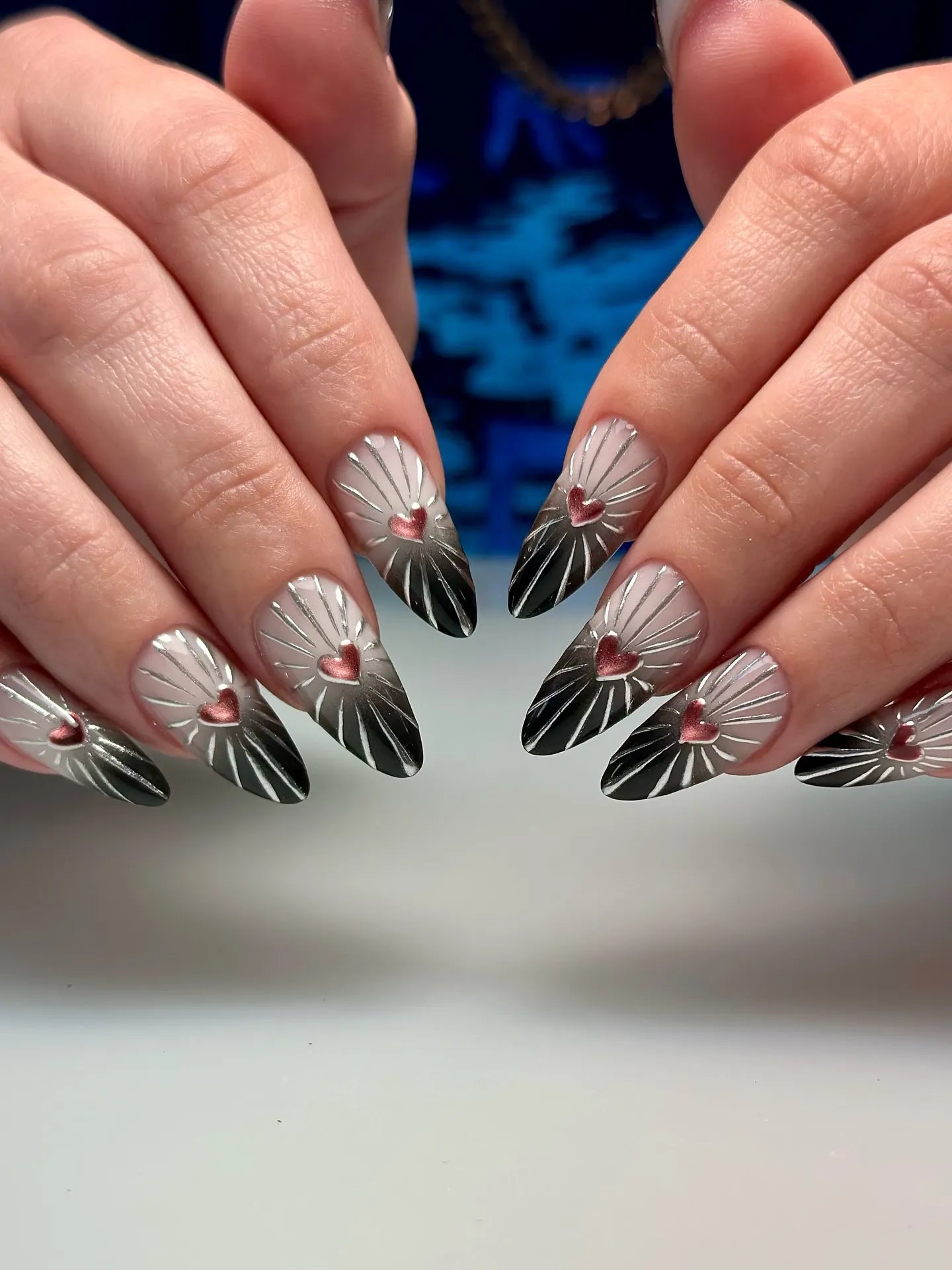 Handmade chrome sunburst press-on nails with pink heart 3D charms and ombre tips