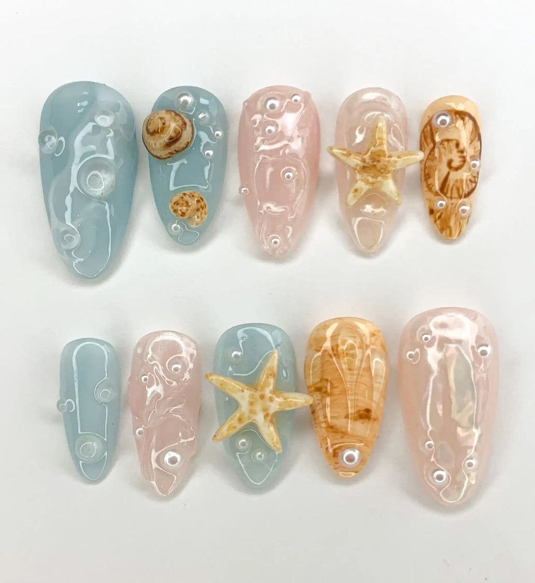 Handmade press-on nails with blue, nude, 3D seashells and starfish beachcore summer design