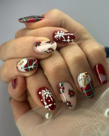 Handmade press-on nails with snowman, holly, red green plaid, and winter Christmas designs.