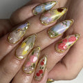 Handmade spring garden floral press-on nails with gold leaf details and rose designs