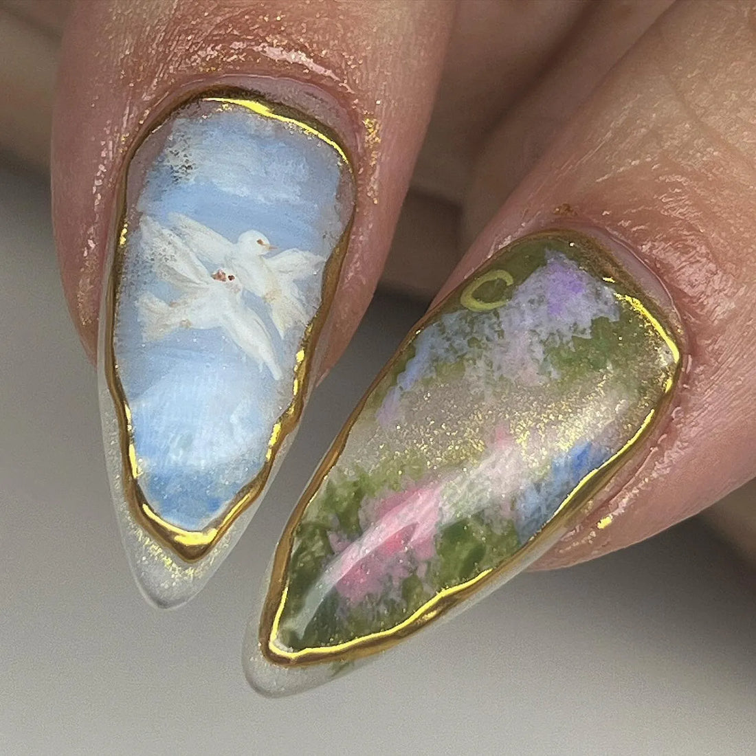 Handmade spring garden floral press-on nails with gold leaf details and rose designs