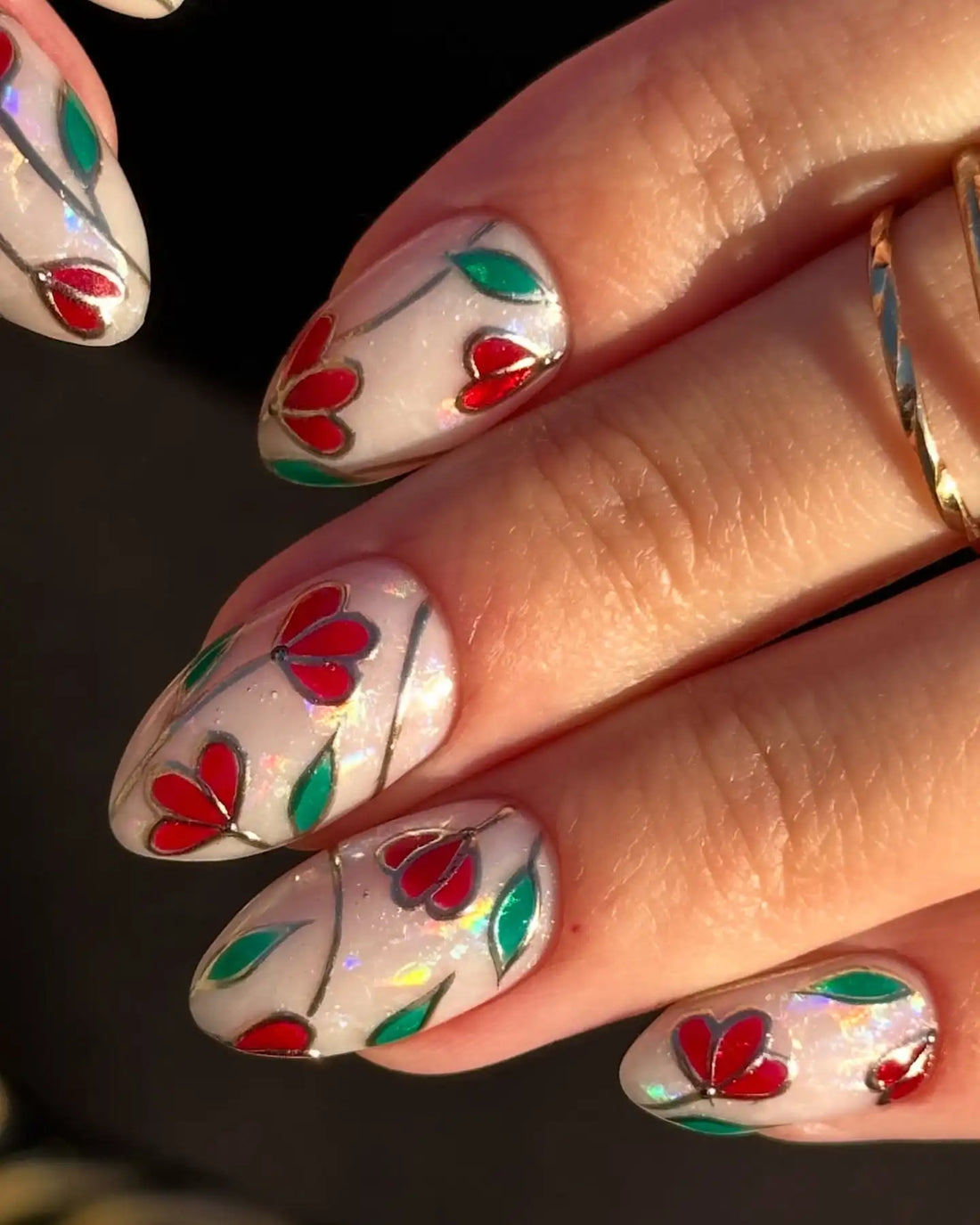 Handmade press-on nails with stained glass effect, red floral and green leaf design