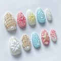 Handmade pastel beach press-on nails with 3D starfish, seashell, and floral designs.