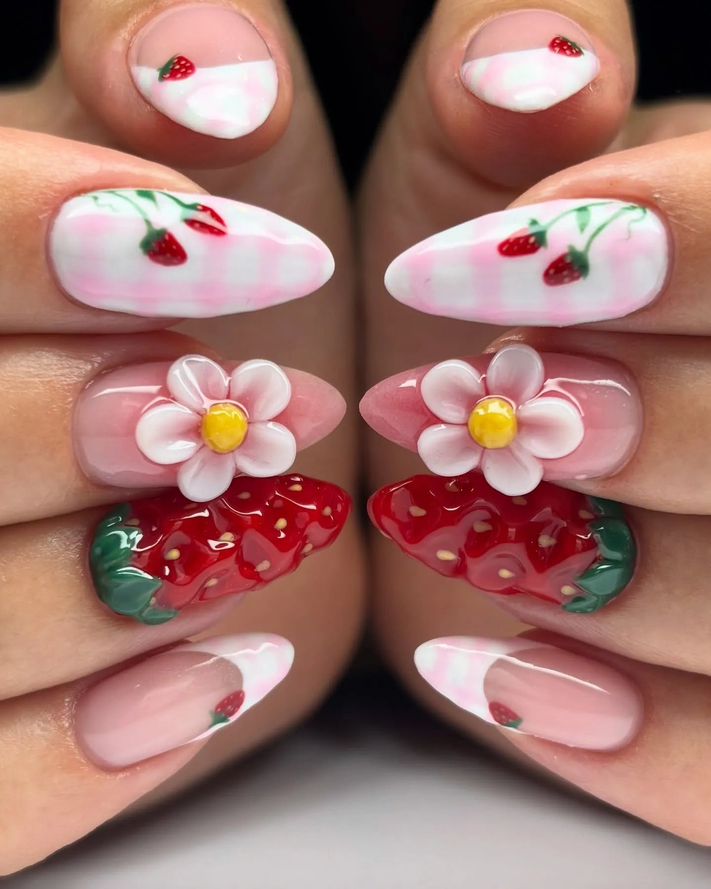 Handmade press-on nails with pink French tips, 3D strawberries, flowers, and gingham accents.