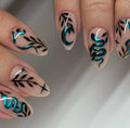 Handmade press-on nails with teal chrome snake, moon, star, and leafy gothic celestial designs.