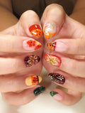 Handmade press-on nails with tropical hibiscus and autumn floral designs in multiple colors.