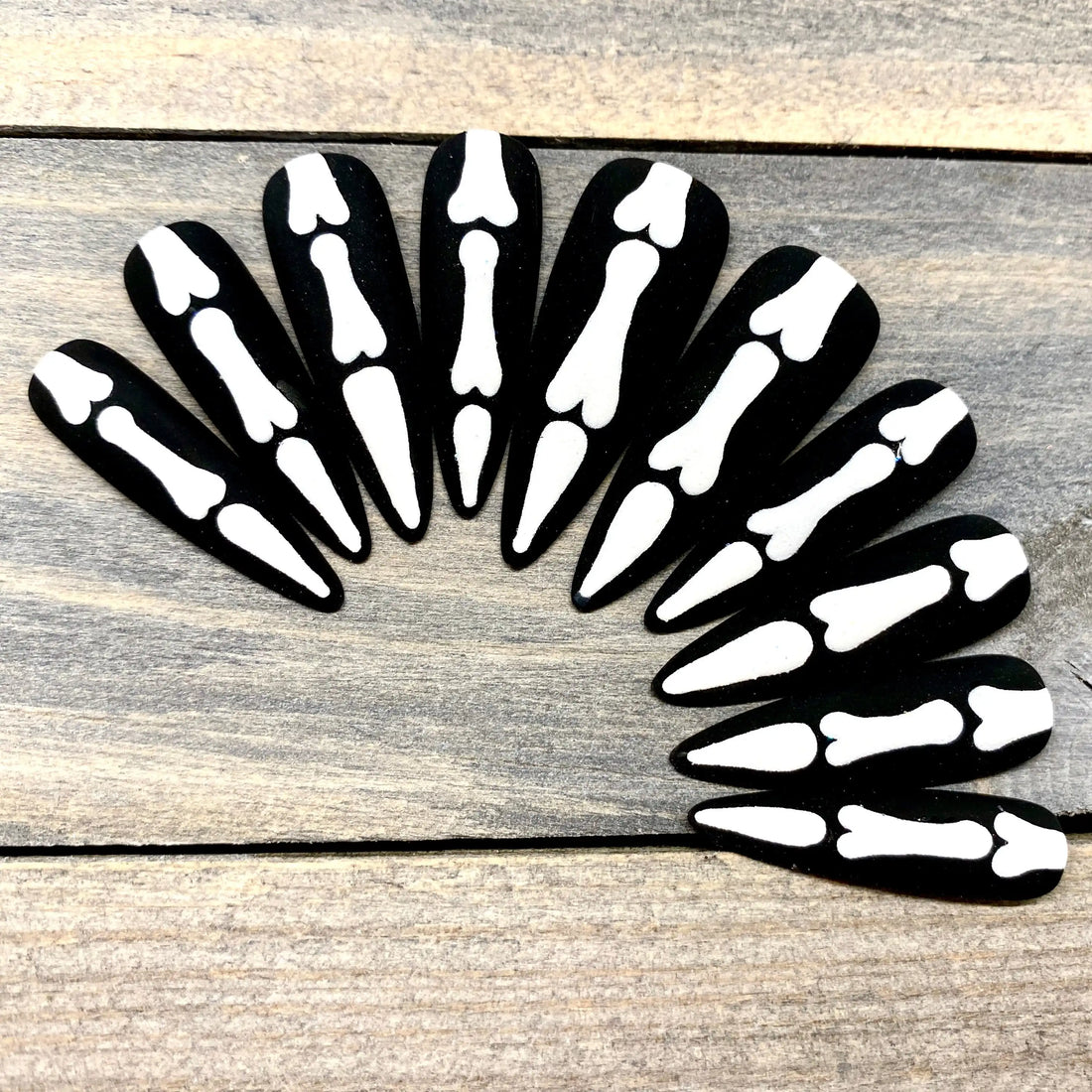 Black press-on nails with white skeleton bone design, Halloween reusable nail set